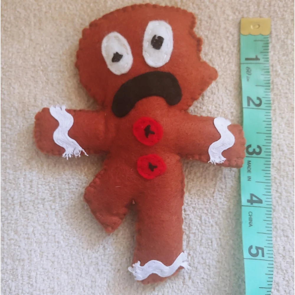 Upset Gingerbread Man Cat Toy
